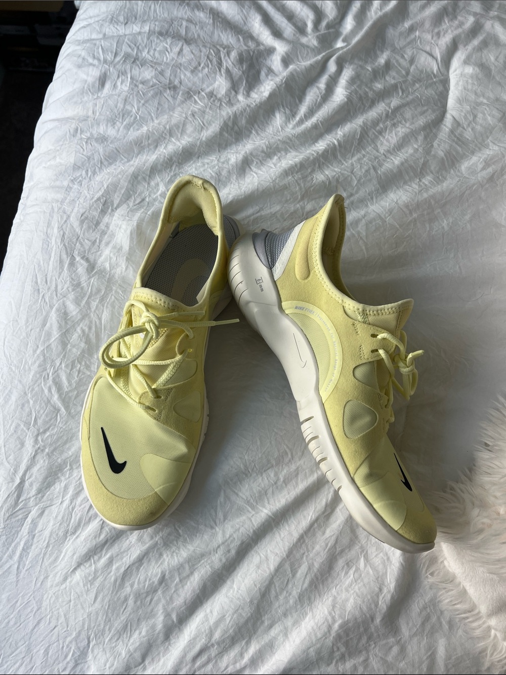 Nike Bright Pale Yellow Running Shoes with Black Swoosh